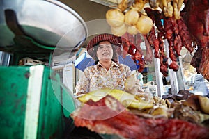 Portrait of Asian woman selling street food