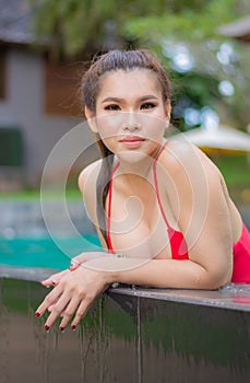 Portrait of an Asian woman in a swimsuit Background   swimming pool