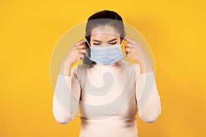 Portrait of Asian woman wearing medical face mask to protect Covid-19