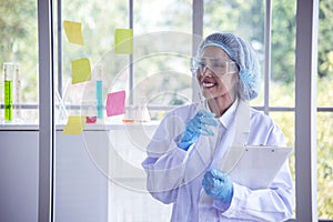 Portrait Asian women scientist laboratory background. female research pathologist clinician expert medical chemist. Woman