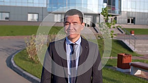 Portrait of Asian young businessman male man looking at camera