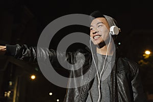 Portrait of a asian young man listening music.