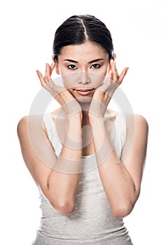 Portrait of Asian young woman looking at camera