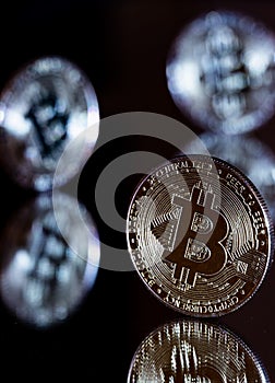 Portrait aspect of metallic bitcoin coin