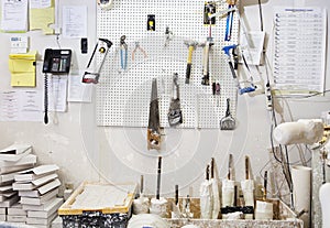 Assorted workshop tools on a pegboard photo