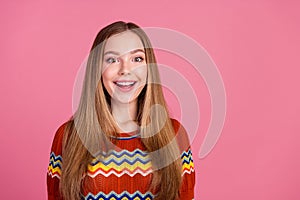 Portrait of astonished cheerful girl toothy smile open mouth empty space isolated on pink color background