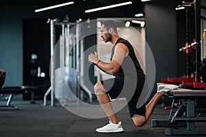 Portrait Of Athletic Black Man Making Bulgarian Split Squat Exercise At Gym photo