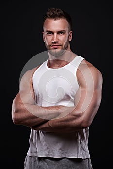 Portrait of athletic man in white undershirt