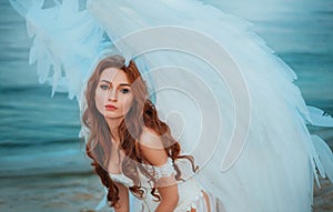 Portrait of an attractive adult angel girl, innocent face blue eyes. Beautiful fashion model young fantasy Woman with