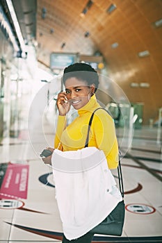 Portrait of an attractive African woman at a metro station