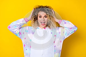 Portrait of attractive amazed cheerful crazy girly wavy-haired girl great news reaction  over bright yellow