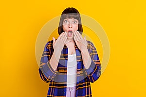 Portrait of attractive amazed girl sudden news reaction stupor srating eyes no way isolated over bright yellow color