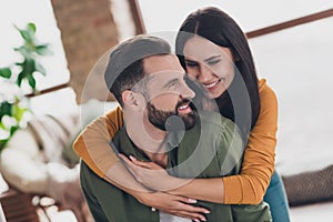 Portrait of attractive amorous sweet cheerful couple hugging spending time weekend day pastime at home house flat