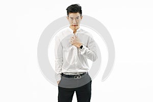 Portrait of attractive asian businessman standing isolated on white background