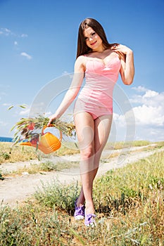 Portrait of an attractive beautiful girl in a poppy field