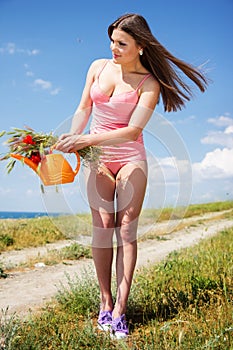 Portrait of an attractive beautiful girl in a poppy field