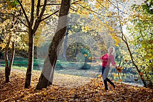 Portrait of an attractive blonde caucasian woman enjoying golden autumn fall season