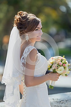 Portrait of attractive bride with bridal bouquet