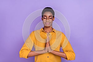 Portrait of attractive brunet dreamy serene girl praying wait anticipate isolated over violet purple color background