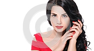 Portrait of attractive brunette girl with red lips and red nails