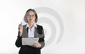 Portrait of attractive business woman in black suit holding tablet and pen isolated on white