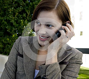 Portrait of an attractive business woman on a cellular phone.