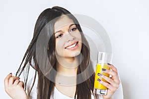 Portrait of attractive caucasian smiling woman isolated on white studio shot drinking orange juice face skin. Portrait of a pretty