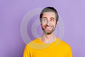 Portrait of attractive cheerful bewildered man thinking copy empty space isolated over pastel violet purple color