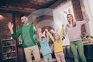 Portrait of attractive cheerful big full family spending vacation dancing having fun easter domestic party indoors