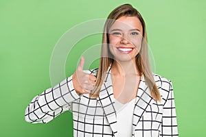 Portrait of attractive cheerful classy smart lady showing thumbup deal done trust advert ad isolated over green color