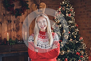 Portrait of attractive cheerful girl folded arms holly jolly spirit decorated house at modern loft industrial style