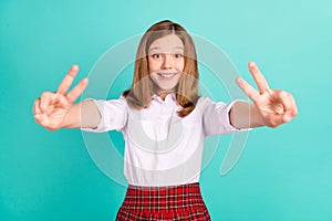 Portrait of attractive cheerful girl giving double ok-sign good mood isolated over vibrant teal turquoise color