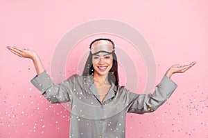 Portrait of attractive cheerful girl throwing confetti having fun hen party  over pink pastel color background