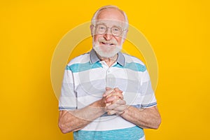 Portrait of attractive cheerful grey haired man friendly service isolated over bright yellow color background