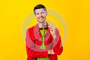 Portrait of attractive cheery modern guy good mood cool look outfit isolated over bright yellow color background