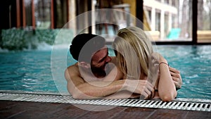 Portrait of attractive couple in swimming pool