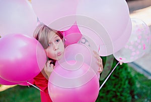 portrait attractive cute cheerful cheery girl helium balls