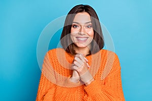 Portrait of attractive delighted cheerful girl enjoying anticipate isolated over bright blue color background