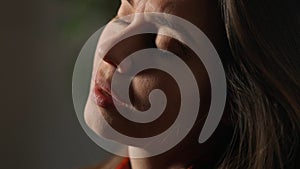 Portrait of attractive female model in negative mood. Close up shot brunette woman face in depressed mood, closed eyes