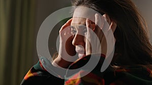 Portrait of attractive female model in negative mood. Close up shot brunette woman face in depressed mood, messy hair