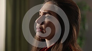 Portrait of attractive female model in negative mood. Close up shot brunette woman face in depressed mood, upset