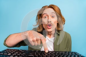 Portrait of attractive funky stunned guy geek learder using computer watching tutorial isolated over pastel blue color