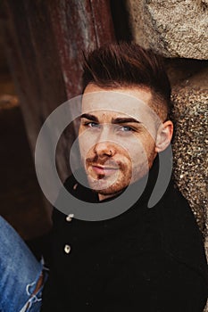 Portrait of attractive guy in a old house.