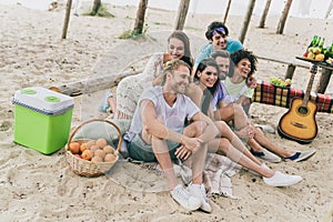 Portrait of attractive guys buddy fellow spending day sunny weather relax fresh air camp at beach picnic outdoors