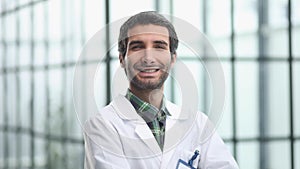 Portrait of an attractive male doctor in a hospital corridor