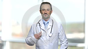 Portrait of attractive male physician with stethoscope.