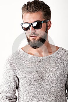 Portrait of an attractive man with a beard isolated on a black background