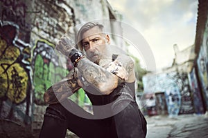 Portrait of an attractive man with a beard and tattoos
