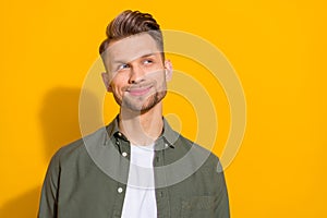 Portrait of attractive minded cheery cunning blond guy thinking copy space isolated over bright yellow color background