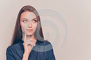 Portrait of attractive minded woman dreaming about something